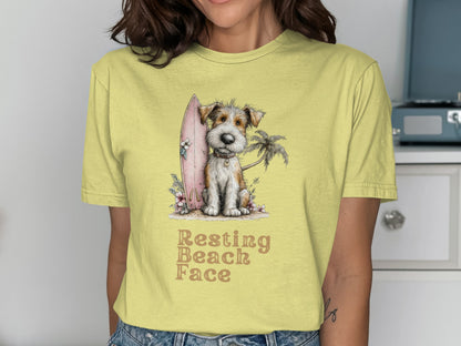 Yellow t-shirt with a scruffy dog, surfboard, and palm tree graphic.