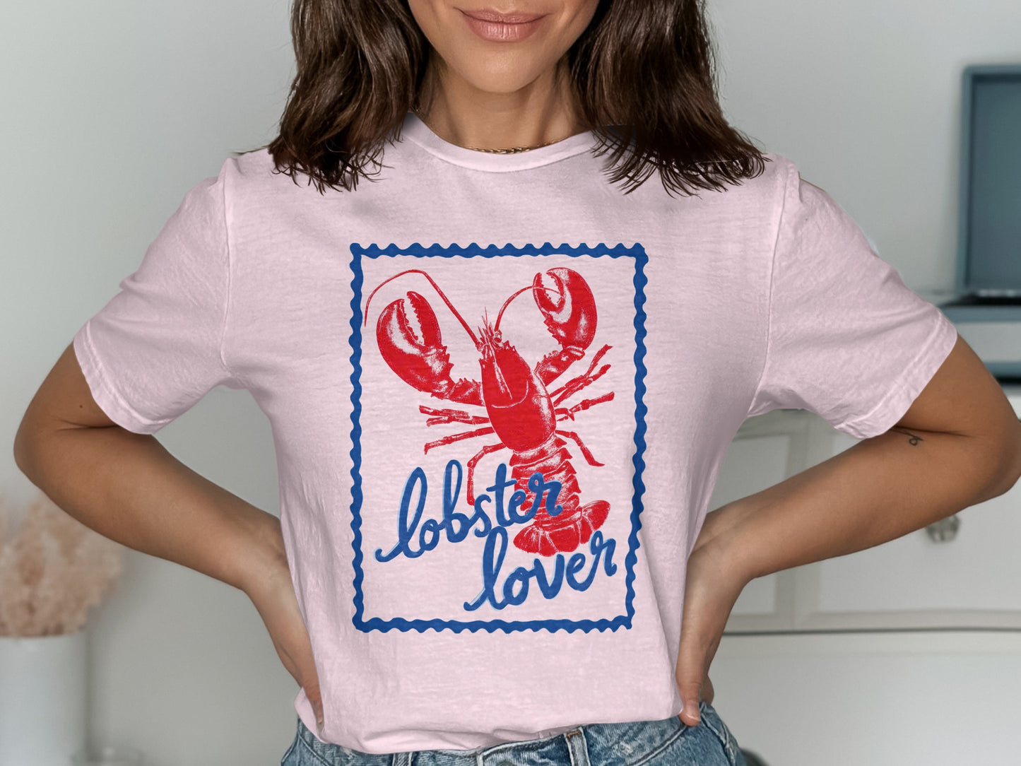 Pink t-shirt with a lobster illustration and "lobster lover" text.