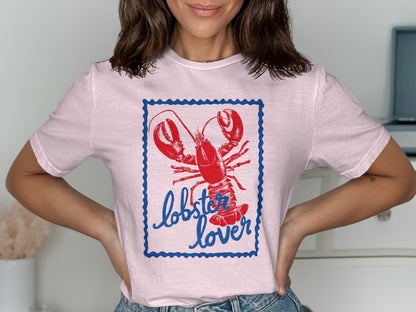 Pink t-shirt with a lobster illustration and "lobster lover" text.