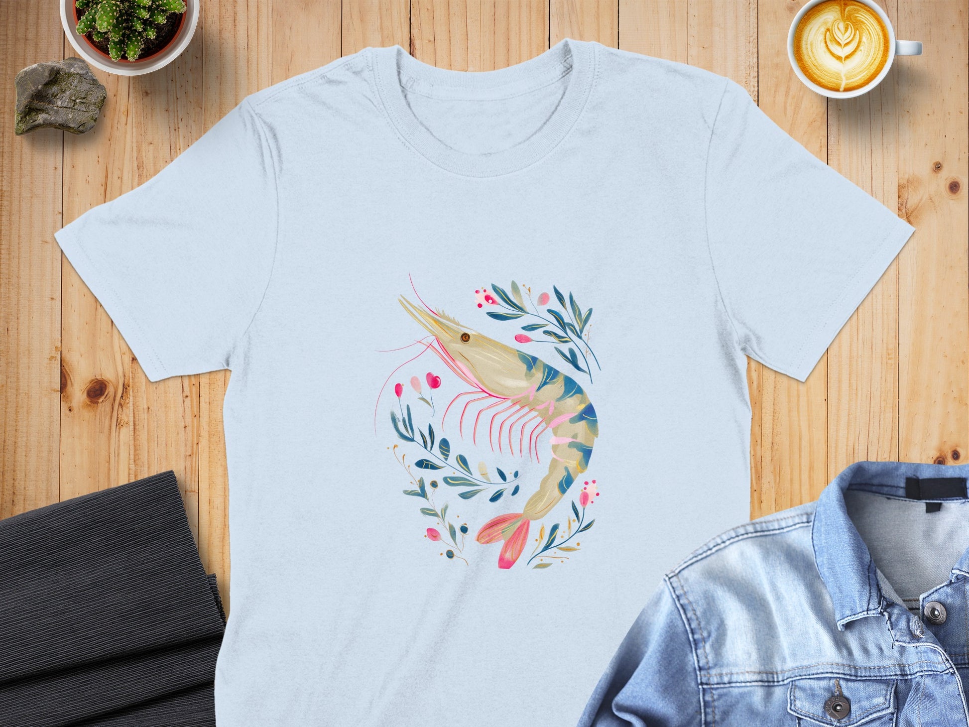 Light blue t-shirt with a watercolor shrimp and floral design.