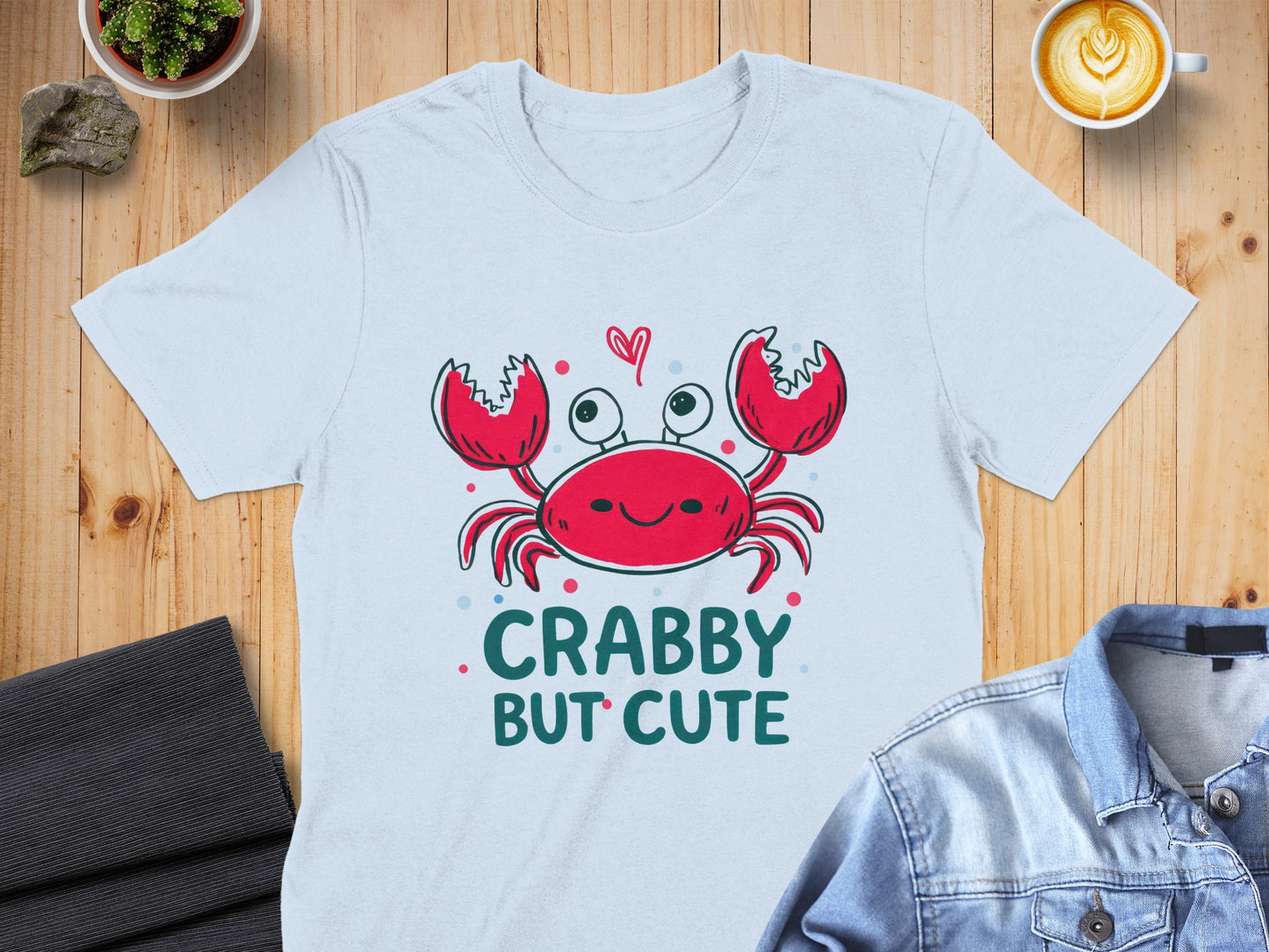 White t-shirt with a red cartoon crab and "CRABBY BUT CUTE" text.