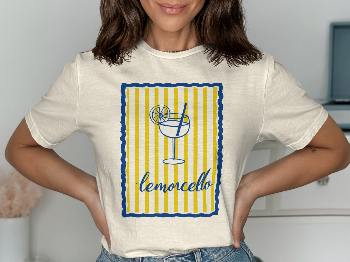 Cream t-shirt with blue and yellow striped frame and limoncello graphic.