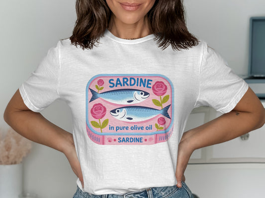 Pink sardine can with two fish and roses, on a white t-shirt.