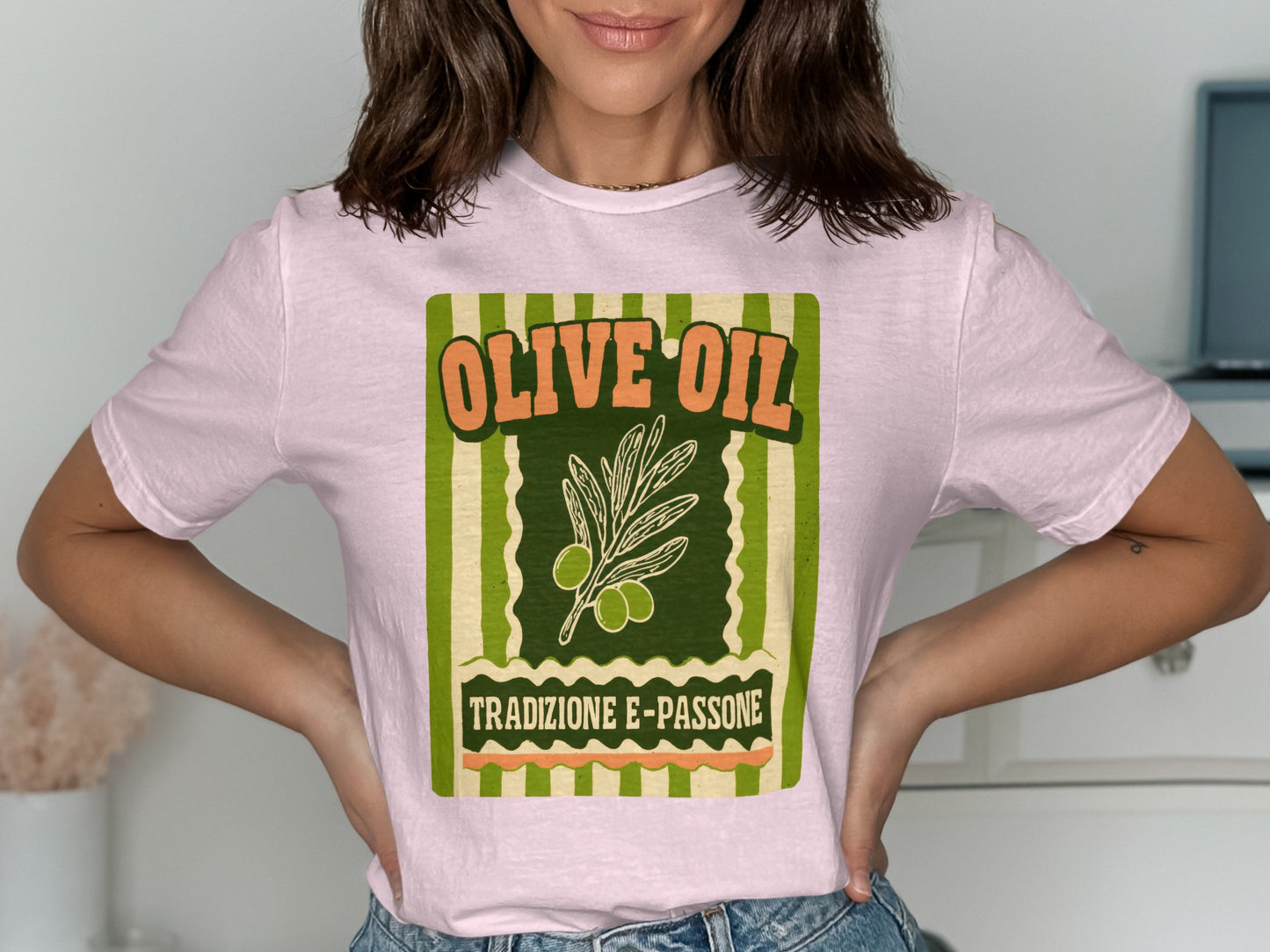 Pink t-shirt with "Olive Oil Tradizione E Passione" text and olive branch graphic.