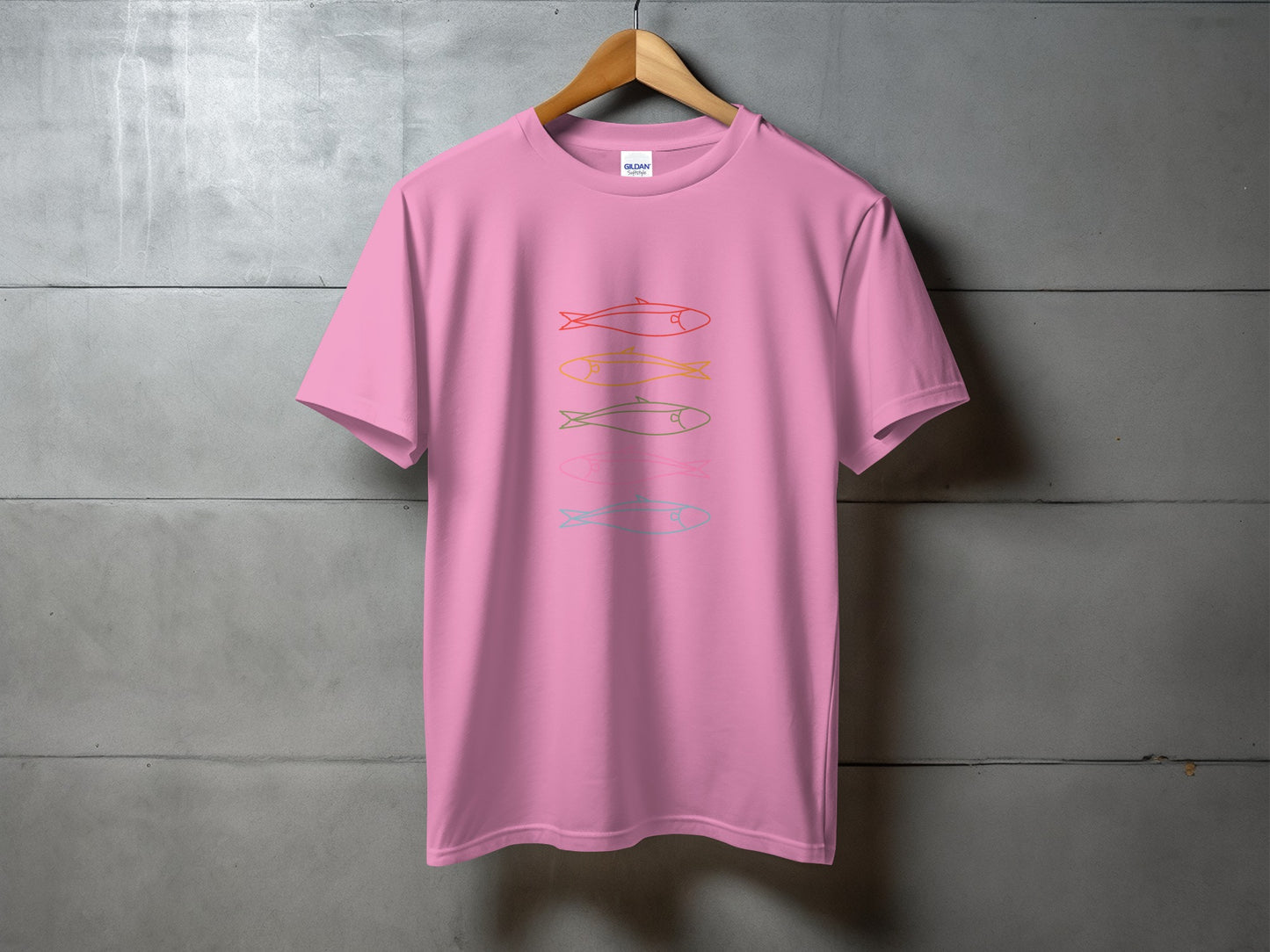Pink t-shirt with four horizontal colorful fish outlines.