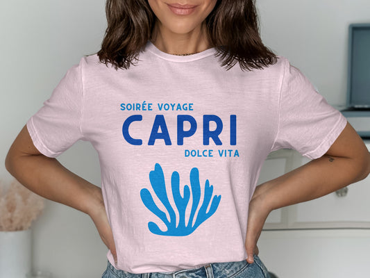 Pink t-shirt with "SOIRÉE VOYAGE CAPRI DOLCE VITA" text and blue coral graphic.
