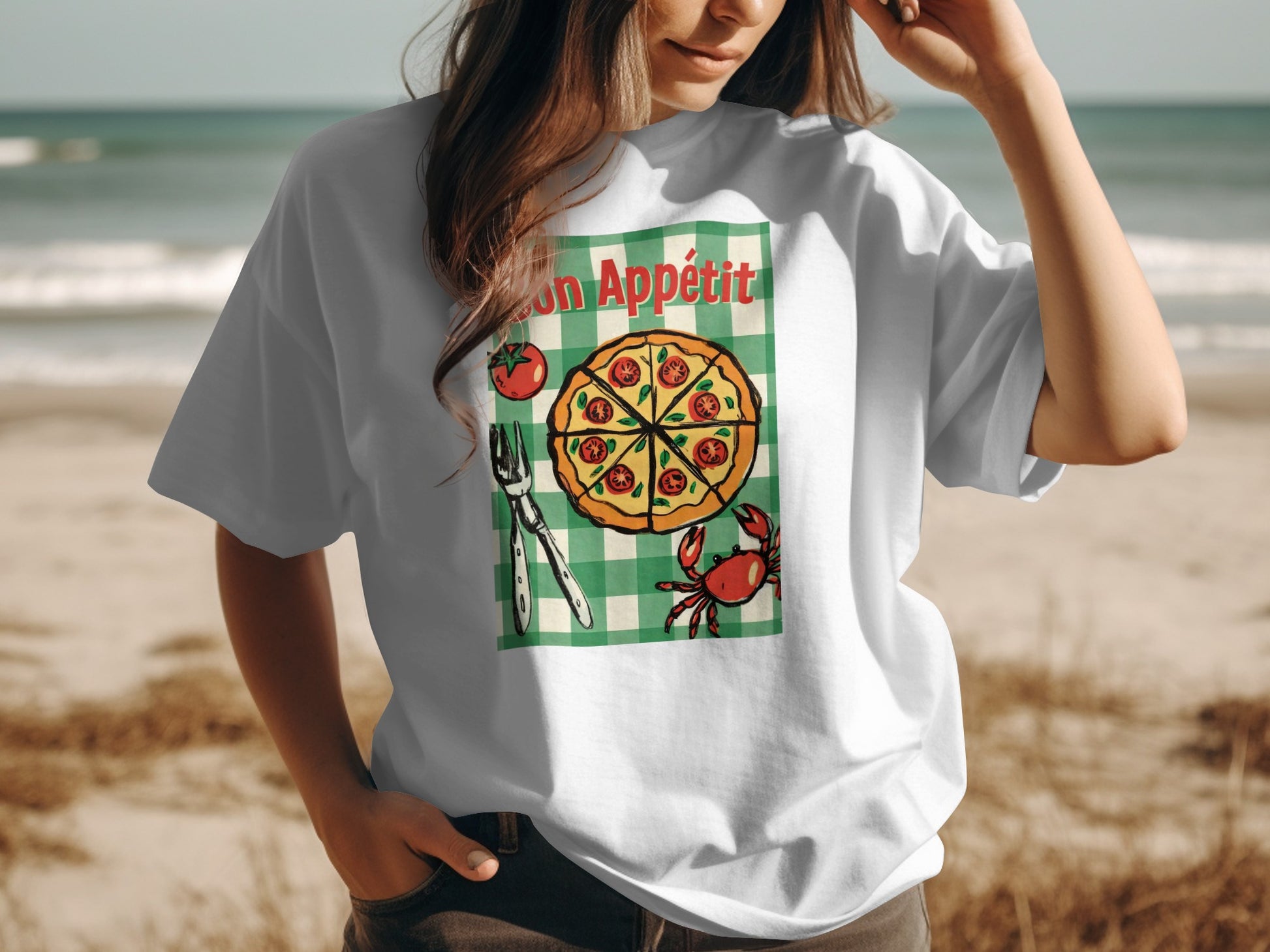 White t-shirt with green gingham and pizza graphic saying "Bon Appétit".