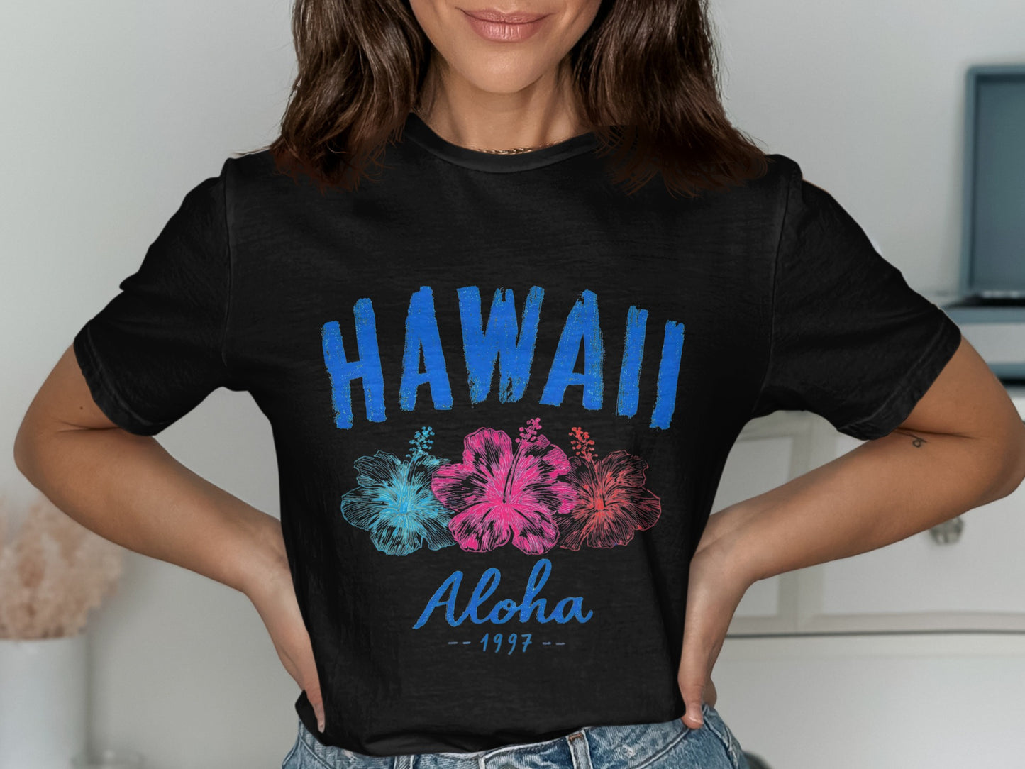 Black t-shirt with "HAWAII Aloha" and three hibiscus flowers.