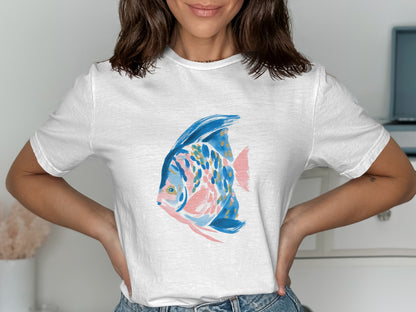 White t-shirt with a pink and blue watercolor fish illustration.