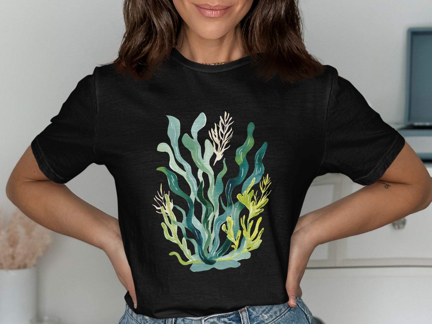 Black t-shirt with colorful seaweed and coral illustration.