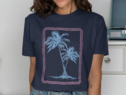 Navy t-shirt with two palm trees and a pink border design.