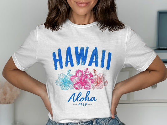 White t-shirt with "HAWAII Aloha 1997" and hibiscus flowers.