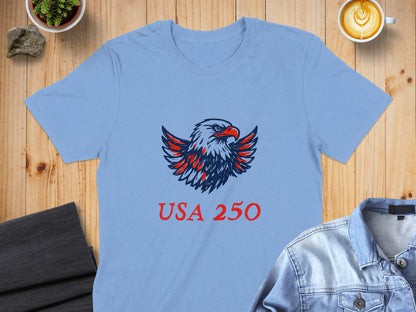 Light blue t-shirt with a red, white, and blue eagle logo and "USA 250" text.