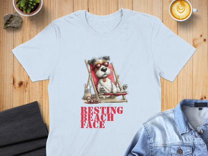 Light blue t-shirt with dog in sunglasses on beach chair, "RESTING BEACH FACE" text.