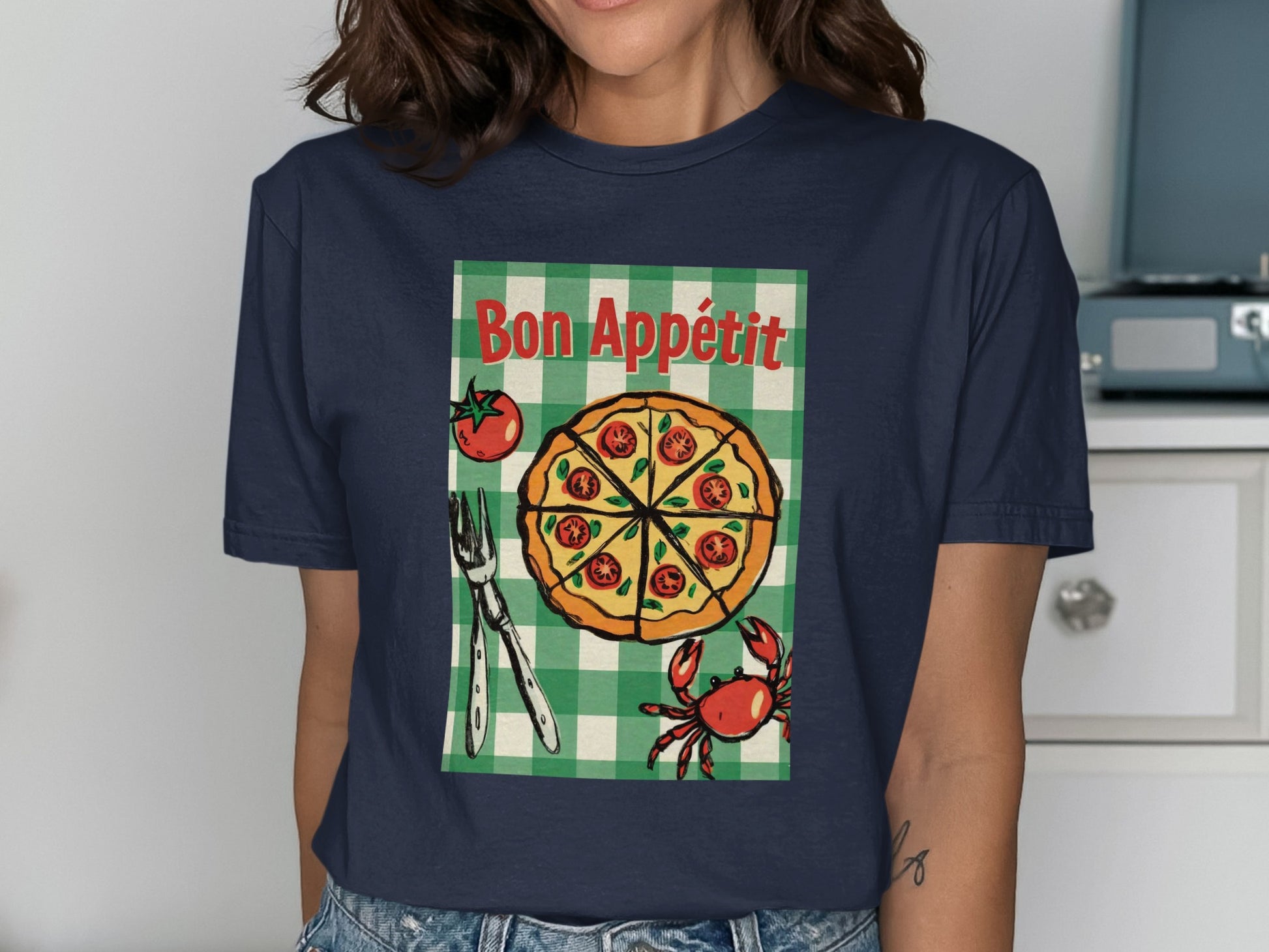 T-shirt graphic with "Bon Appétit" and a pizza with crab and tomato.