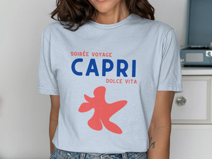 Light blue t-shirt with red abstract figure and "CAPRI DOLCE VITA" text.