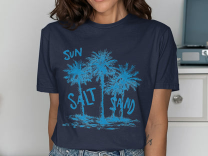 Navy t-shirt with blue palm trees and text "SUN SALT SAND".