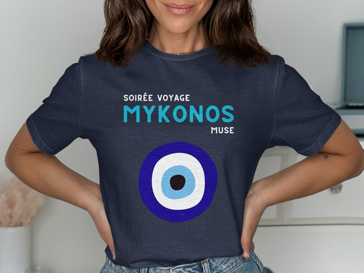 Navy t-shirt with "Soirée Voyage Mykonos Muse" and blue and white evil eye.