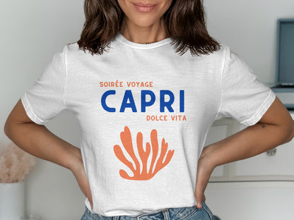 White t-shirt with "Soirée Voyage Capri Dolce Vita" text and orange coral graphic.