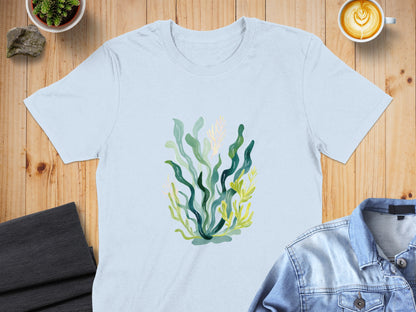 Light blue t-shirt with a stylized illustration of green and yellow seaweed.