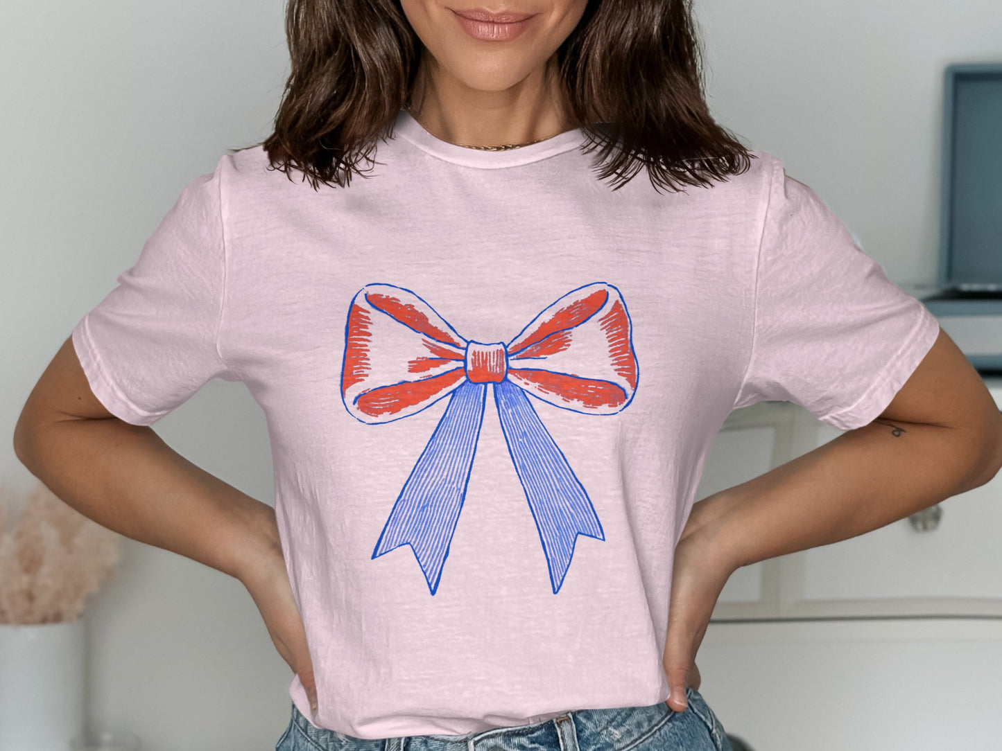 Stylish Pink T-Shirt with Blue and Red Bow Design product