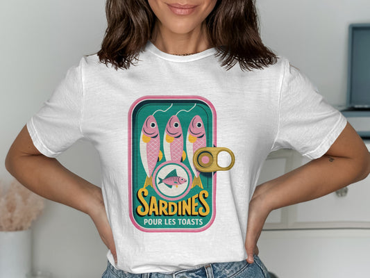 White t-shirt with a vintage sardine can graphic featuring three sardines.