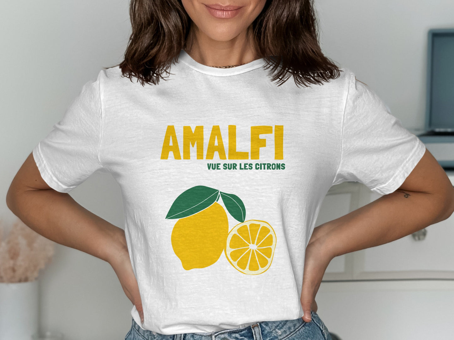 White t-shirt with "AMALFI" and lemon graphic.