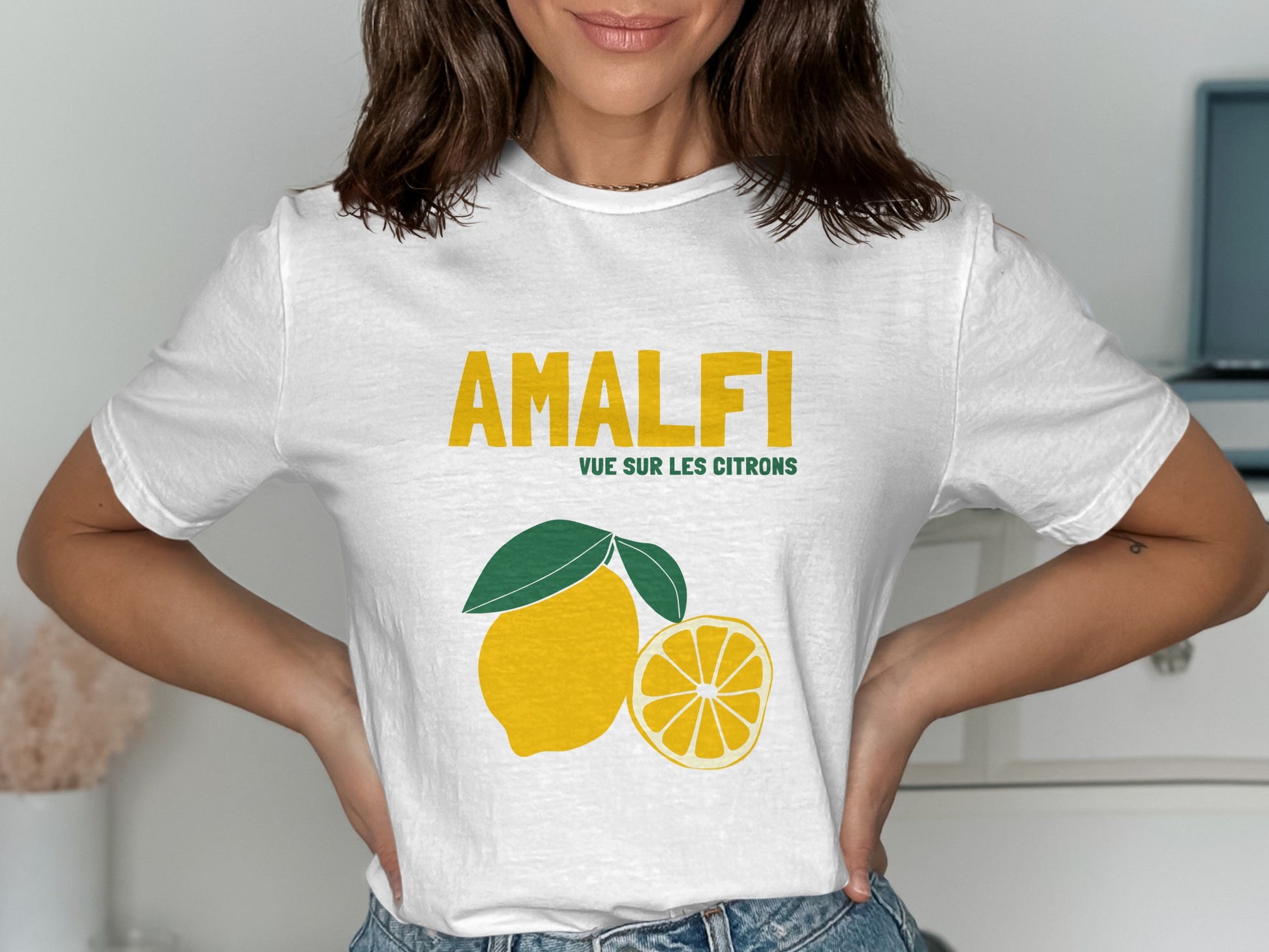 White t-shirt with "AMALFI" and lemon graphic.