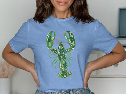 Blue t-shirt with a green ornate lobster graphic.