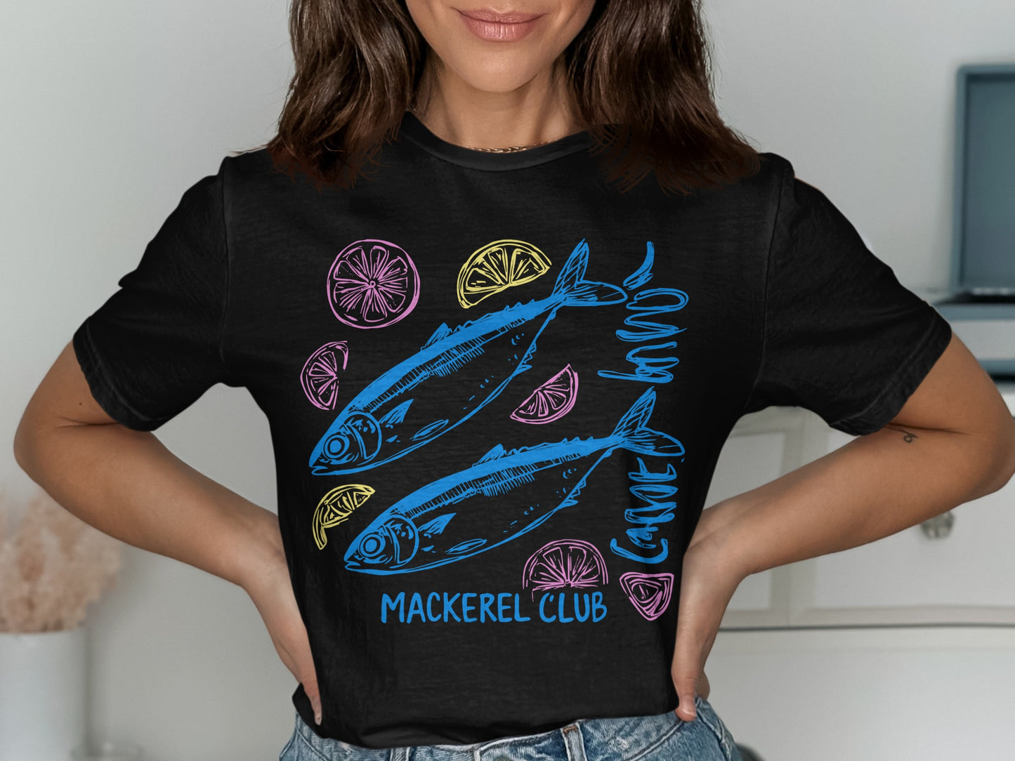 Black t-shirt with two blue fish, lemon slices, and "Mackerel Club" text.