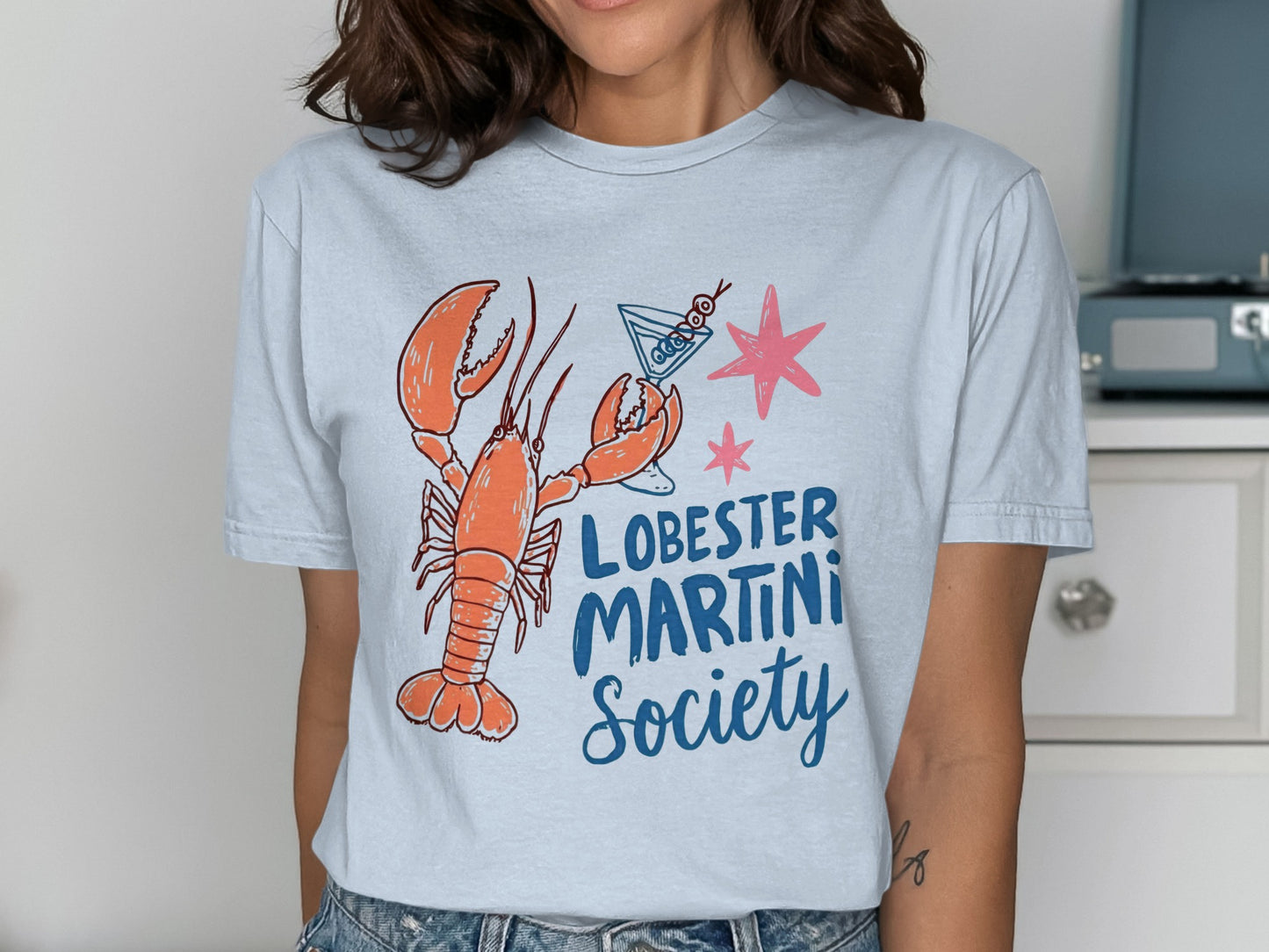 T-shirt with lobster, martini glass, and text "Lobster Martini Society".
