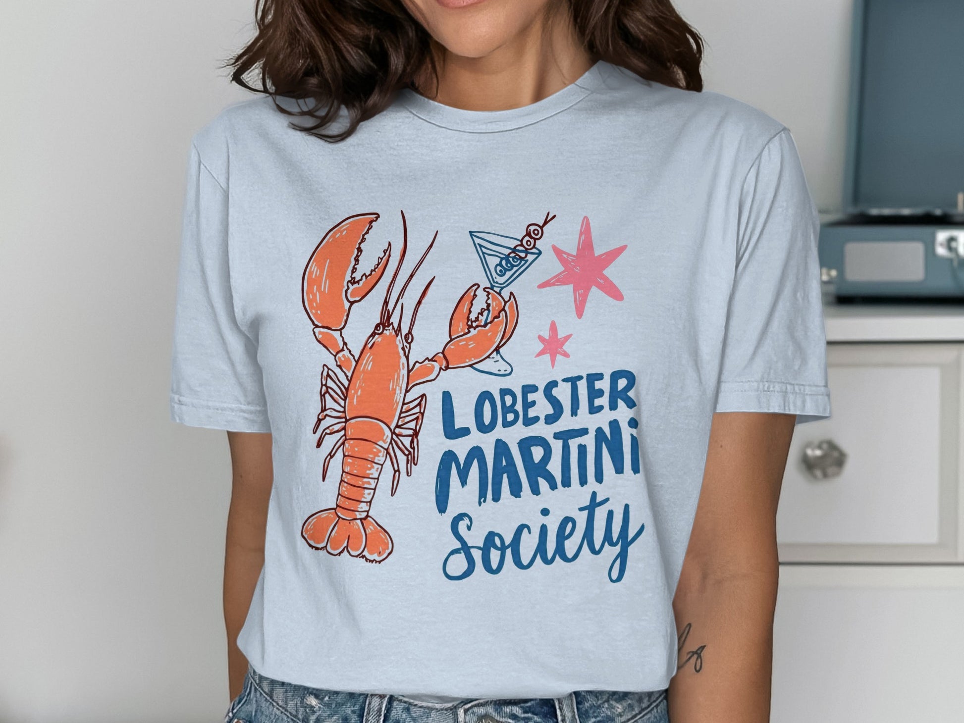 T-shirt with lobster, martini glass, and text "Lobster Martini Society".