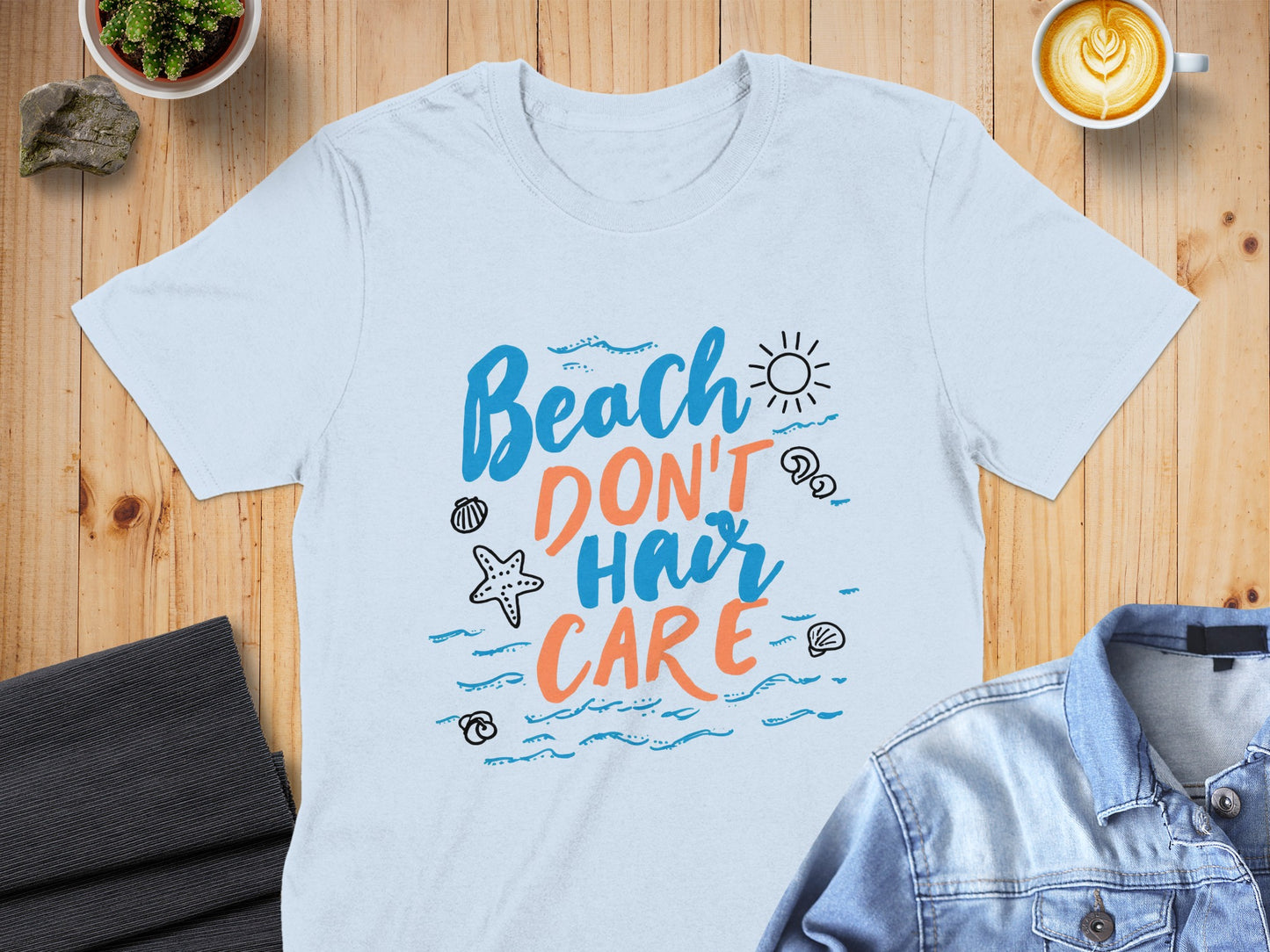 Light blue t-shirt with "Beach Don't Hair Care" text and beach icons.
