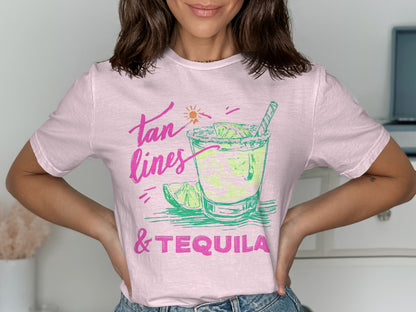 Pink t-shirt with "Tan lines & Tequila" graphic featuring a margarita.