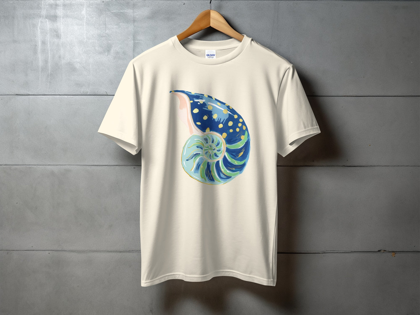 Cream t-shirt with a colorful nautilus shell graphic.