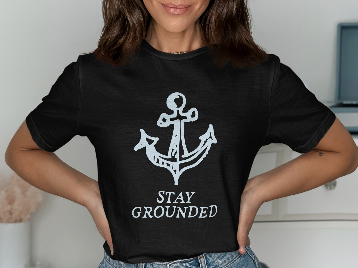 Black t-shirt with white anchor graphic and "STAY GROUNDED" text.