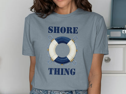 Blue t-shirt with life preserver graphic and "SHORE THING" text.