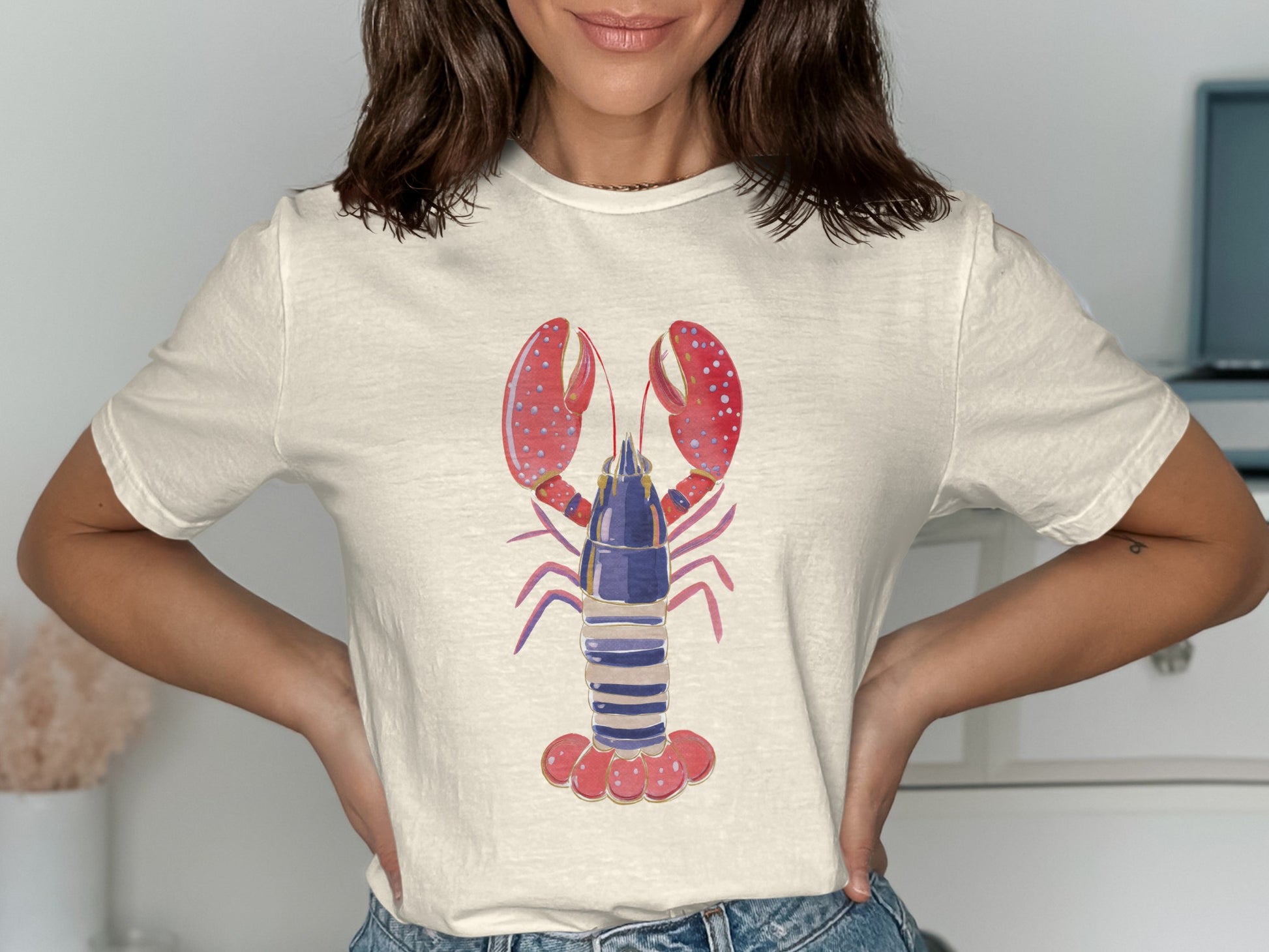 White t-shirt with a blue, purple, and red lobster graphic.