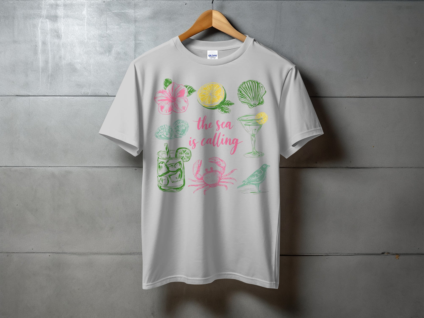 White t-shirt with colorful tropical vacation themed graphics and text.