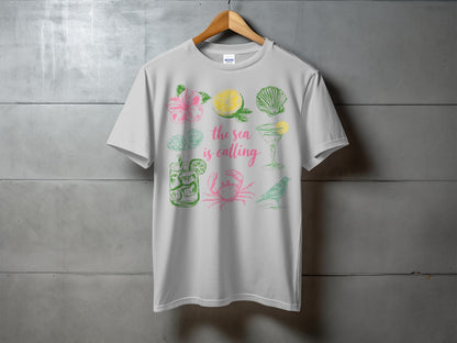 White t-shirt with colorful tropical vacation themed graphics and text.