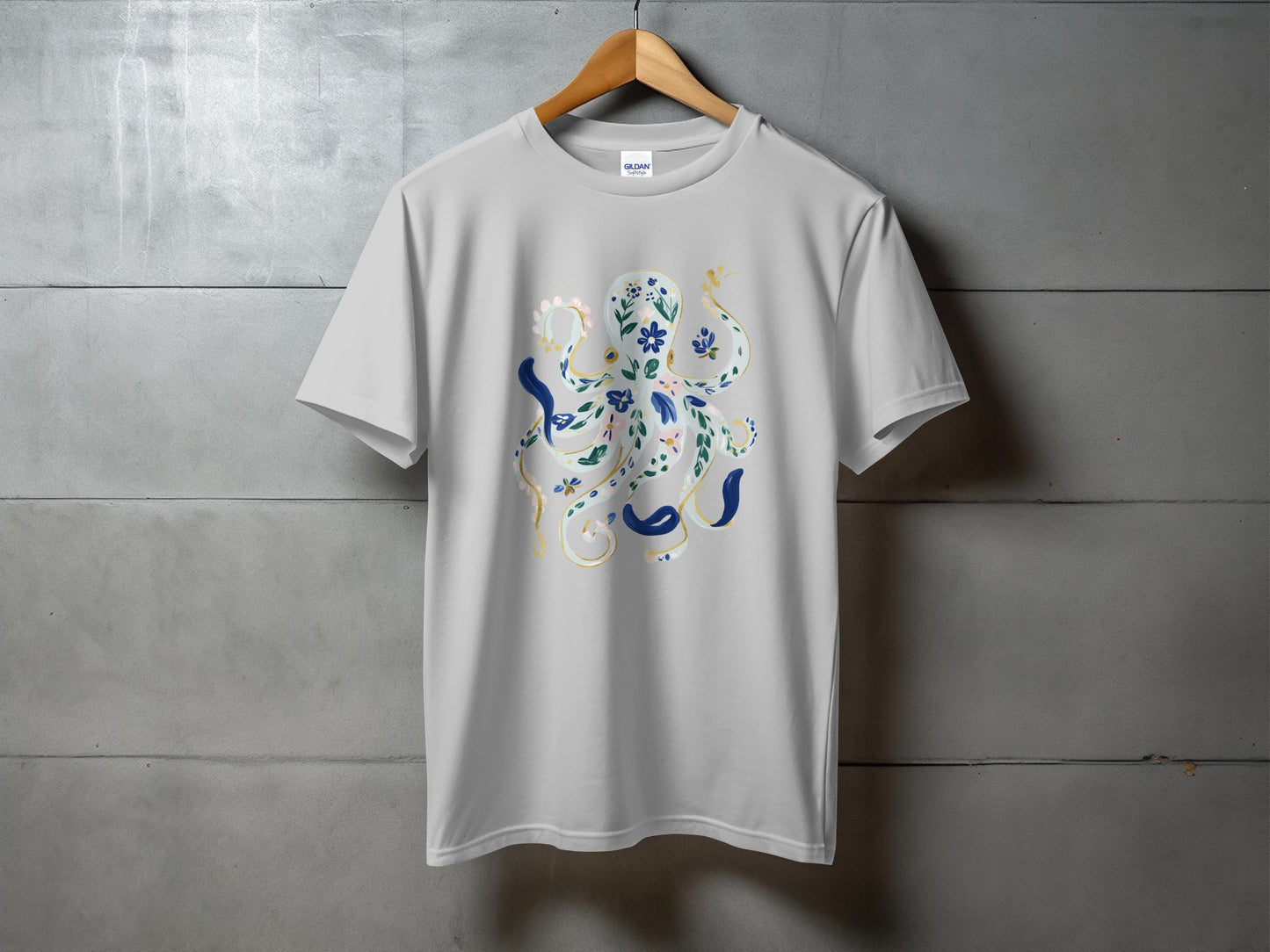 Grey t-shirt with a floral octopus graphic in blue and gold.