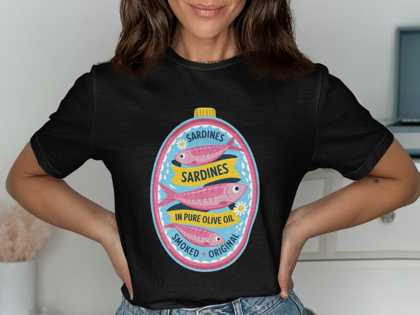 Black t-shirt with a graphic of a sardines in olive oil can.