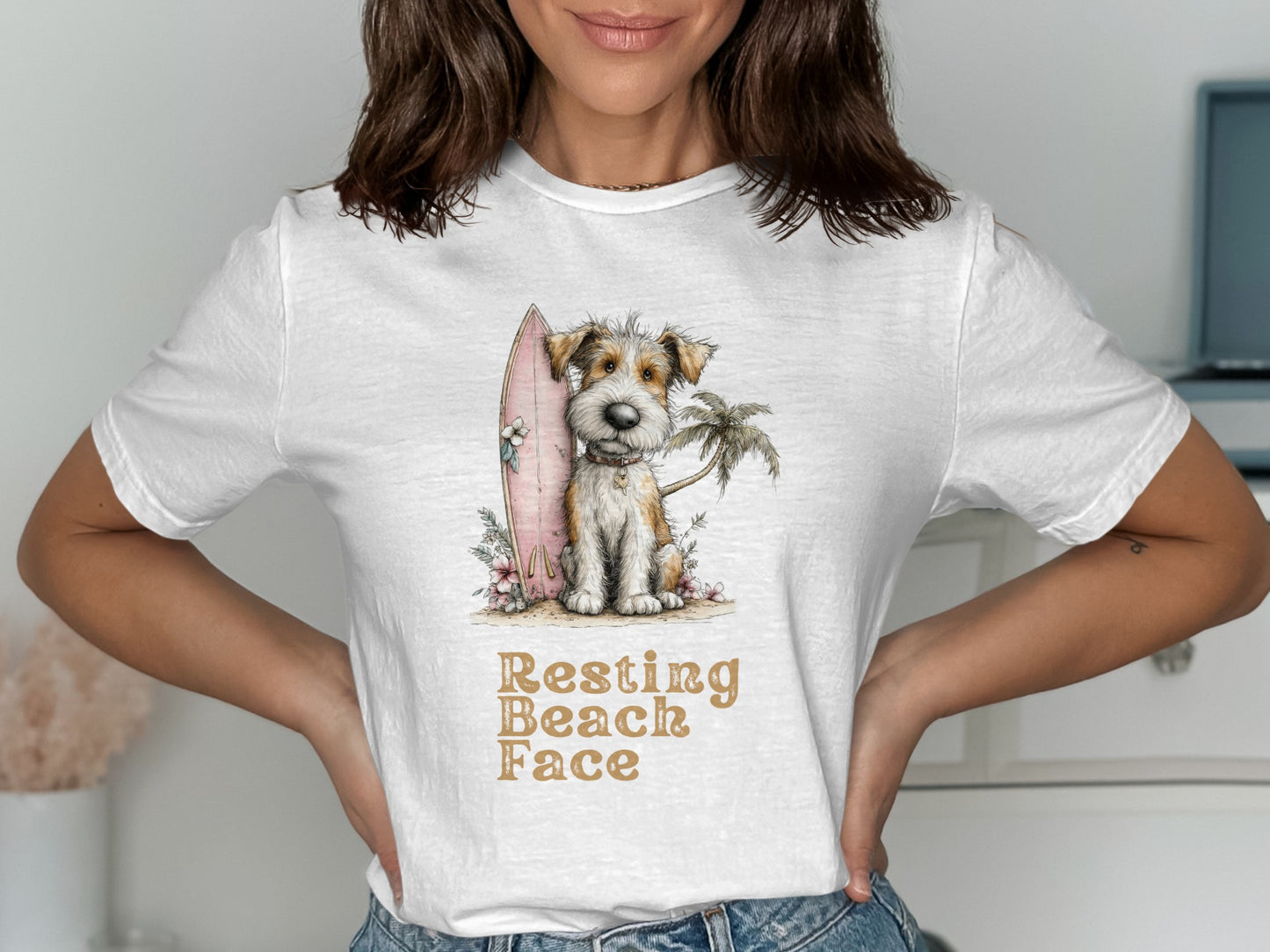Dog with surfboard and palm tree on white t-shirt with text "Resting Beach Face".