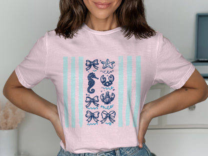 Light pink t-shirt with blue nautical illustrations in columns.