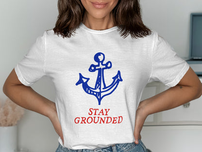 White t-shirt with blue anchor and red "STAY GROUNDED" text.