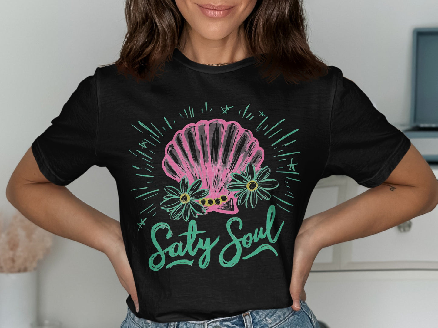 Black t-shirt with pink seashell, flowers, and "Salty Soul" text.