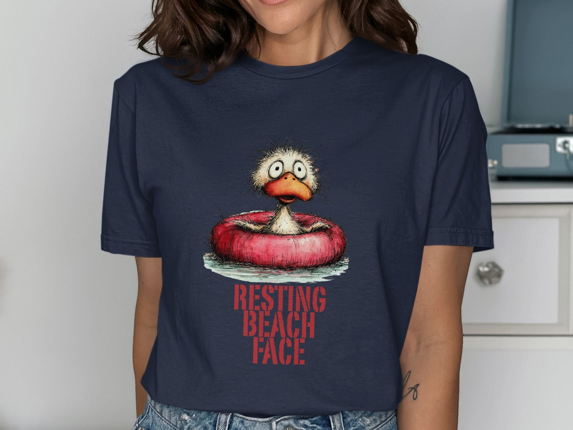 Cartoon duck with worried expression in inner tube, "RESTING BEACH FACE" text.