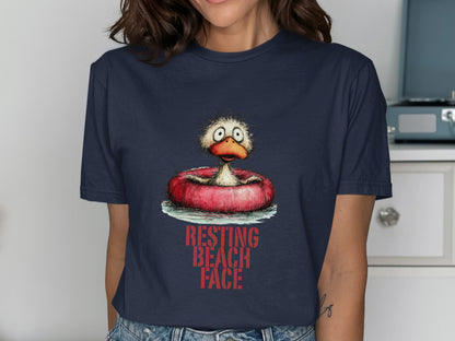 Cartoon duck with worried expression in inner tube, "RESTING BEACH FACE" text.