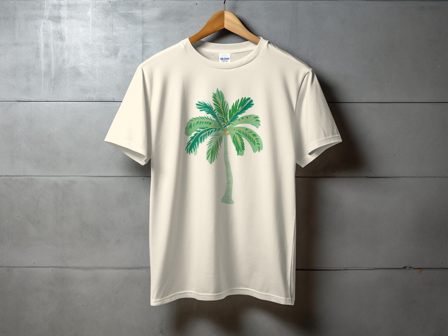 Cream t-shirt with a watercolor palm tree graphic on the front.