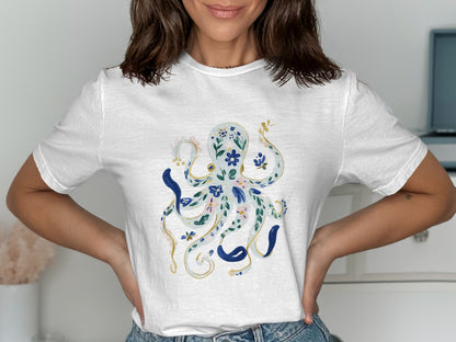 White t-shirt with a blue and gold floral octopus graphic.